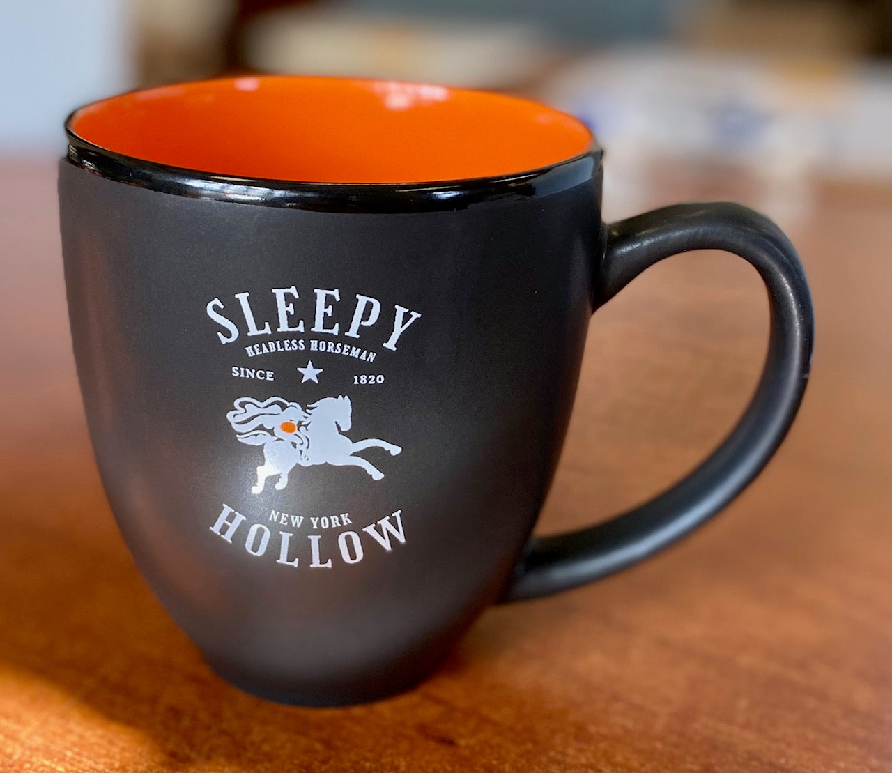 Our matte black bistro mug features the Headless Horseman and his hometown of Sleepy Hollow, New York.